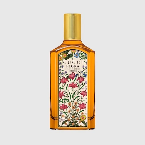 Golden Gucci Flora Gorgeous Orchid Intense bottle with a gold cap and floral label