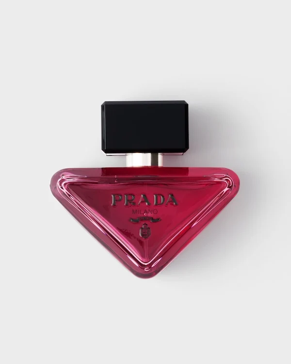 Pink triangular Prada Paradoxe Sweet Chemistry bottle with a black cap